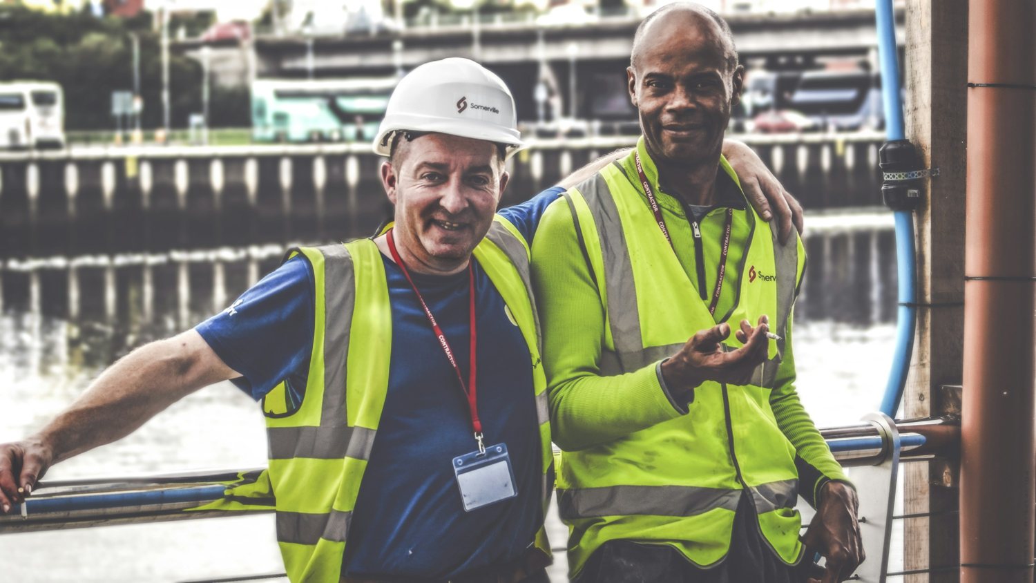 Two tradies sharing a laugh back on site